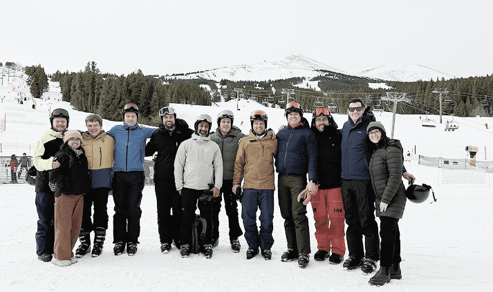 The Texture team standing together in snowy mountains.